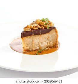 Nuts Tart Isolated On White Background. Sweet Pie With Nuts And Caramel Sauce. Dessert With Praline, Chocolate And Cashew, Hazelnut, Peanut And Caramel Sauce. Toffee Nut Pie In Restaurant Menu