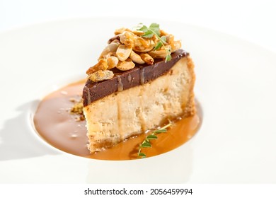 Nuts Tart Isolated On White Background. Sweet Pie With Nuts And Caramel Sauce. Dessert With Praline, Chocolate And Cashew, Hazelnut, Peanut And Caramel Sauce. Toffee Nut Pie In Restaurant Menu