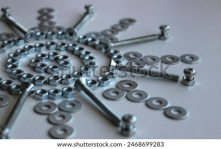Nuts, Washers And Bolts Arranged In Pattern On White Surface Angle View 
