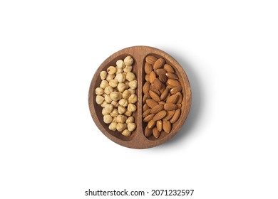 nuts in wooden bowl. Food mix background, top view, copy space, banner. Assortment of nuts - cashew, hazelnuts, almonds, walnuts, pistachio, pecans, pine nuts, peanut, raisins.