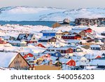 Nuuk city covered in snow with sea and mountains in the background, Greenland