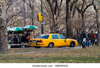 NY - MANHATTAN, 31 DEC 2014: Classic Scenario Of People And Yellow Cab Inside Central Park In Manhattan