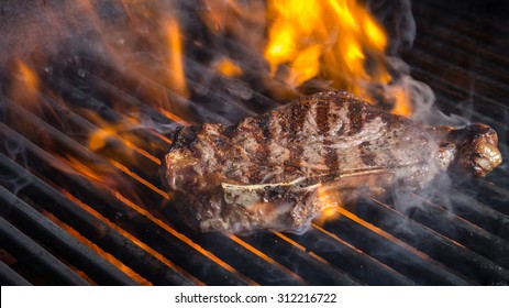 NY Strip Steak On Grill With Flames