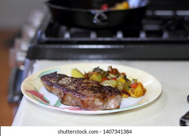 NY Strip Steak With Potatoes On A Plate.