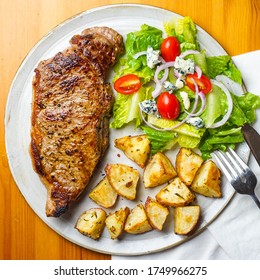 NY Strip Steak With Roasted Potatoes And Salad.