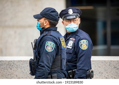 NY, NY, USA - Jan. 22, 2021: Postal Service Inspection Police Offcers Wearing Masks On The Street