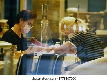 NY, NY- USA July 17, 2020 A Woman Has Her Nails Done At A Nail Salon In Midtown On July 17, 2020 In New York City.