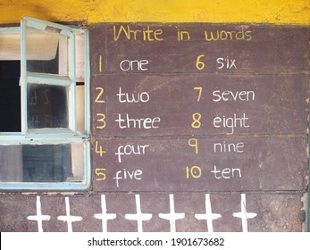 Nyahururu, Kenya - Taken In April 2016: Kenyan School's Wall For Learning Numbers In English. Numbers From One To Ten Written With Chalk To School Wall.