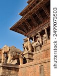 At the Nyatapola Temple, stone statues, guardians lined up in a row next to the stairs in front of the elaborate roof construction, Bhaktapur, Nepal 2022