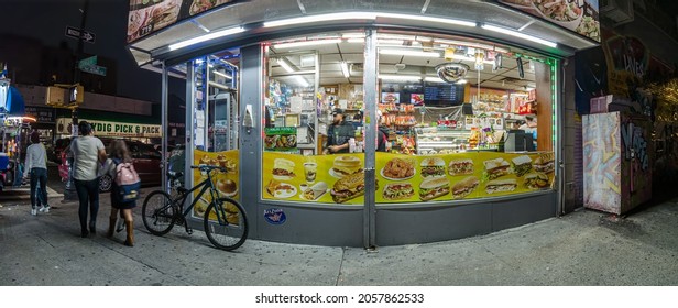 NYC Grocery Store Window At Night  In A Poor Neighborhood, New York, Bronx, Lydik Avenue, 10462, United States Of America, 10.13.2021