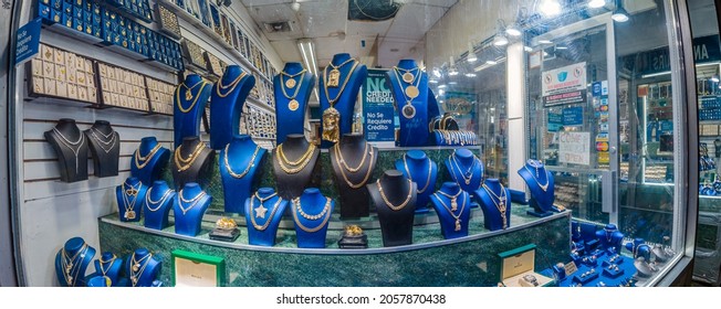 NYC Jewelry Shop Window At Night Storefront With Jewelry In A Poor Neighborhood, New York, Bronx, Lydik Avenue, 10462, United States Of America, 10.13.2021