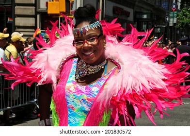 NYC - June 29, 2014:  Woman With Spectacular Pink Feather Boa Wrap At The 2014 Gay Pride Parade On Fifth Avenue