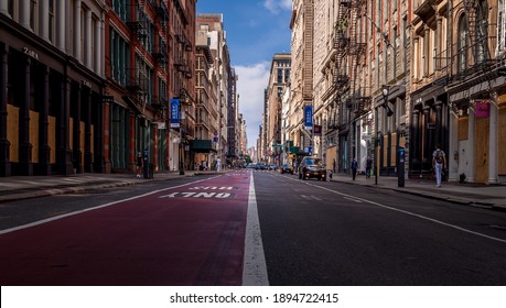 NYC, NY, USA - June 10, 2020.
Empty Street Of Manhattan During Pandemic Time. Storefronts Protected  With The Wooden Boards From Violent Protests, Riots And Looting Resulting From George Floyds Death.