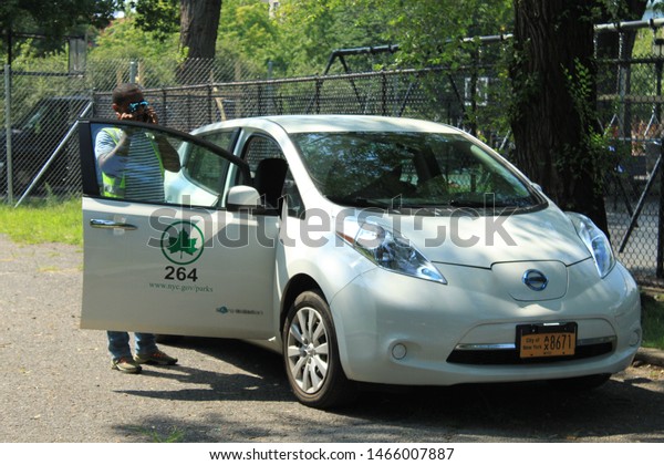 NYC Parks Dept Car, white parks department car in\
brower park located in crown height section of Brooklyn  on a sunny\
summer day July 28 2019