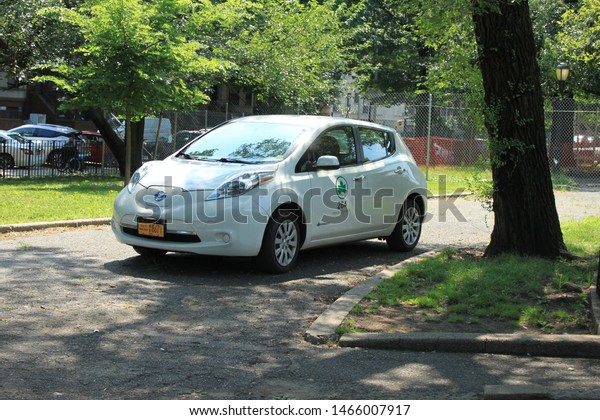 NYC Parks Dept Car, white parks department car in\
brower park located in crown height section of Brooklyn  on a sunny\
summer day July 28 2019