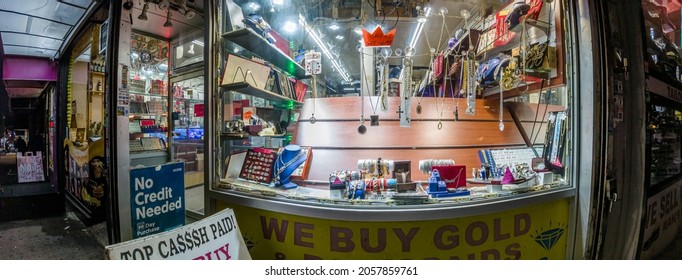 
NYC Pawn Shop Window At Night Storefront With Jewelry In A Poor Neighborhood, New York, Bronx, Lydik Avenue, 10462, United States Of America, 10.13.2021