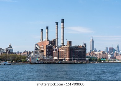 NYC, USA - September 23, 2019: Con Edison Power Plant In Mahattan And Empire State Building In The Background.
