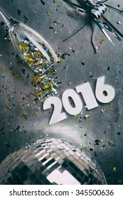 NYE: Grungy 2016 New Year Background With Spilled Confetti