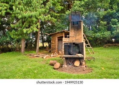 Nyika, Malawi, March 2016: Outdoor Wood Stove Heating Water For Off-grid Camping Shower