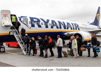 NYKOPING, SWEDEN - OCTOBER 14, 2013: Passengers Boarding Ryan Air Plane Towards London