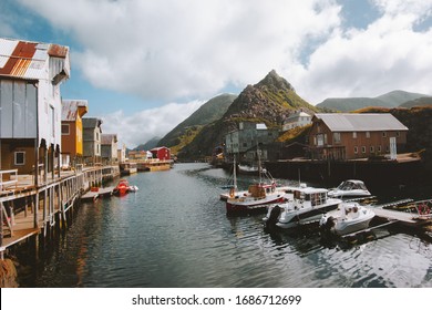 Nyksund fishing village in Norway traditional architecture wooden houses rorbu and fjord with mountains scandinavian travel destinations landscape