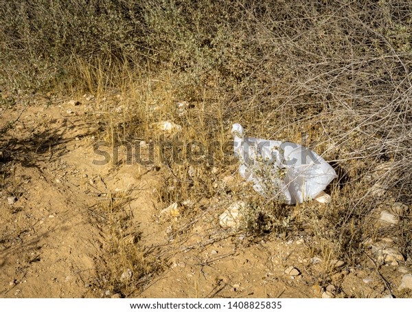 a nylon bag
thrown in the open desert
outdoors