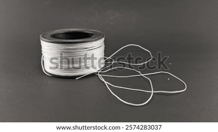 Nylon thread that blends with nature, showing the beauty and simplicity of synthetic materials.