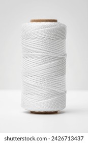 Nylon twine strings bobbin spool cord reel thread cylinder silky white background