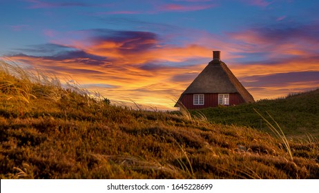 Nymindegab, Denmark - 07 Juli 2018: Small Red House On The Danish West Coast That Is Filled With Beautiful Nature And Dunes