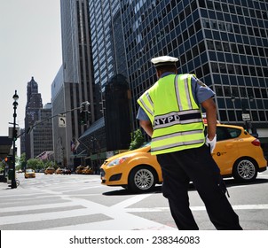 NYPD Officer Directing Traffic In New York City.