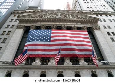 NYSE New York City/USA - September 2, 2019: The Exterior Of The New York Stock Exchange With Large American Flag Draped Along The Front Of The Building.