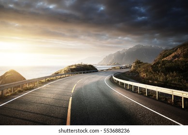 oad by the sea in sunrise time, Lofoten island, Norway - Powered by Shutterstock