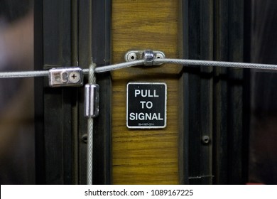 Oahu, HA / USA - Circa 2006: "Pull to Signal" sign on old bus.