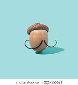 Oak Acorn With French Moustache. Funny Beret Gentleman. France, Nature Creative Concept.