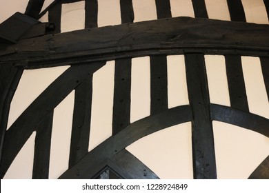 Oak timber frame from inside a Medieval hall. Timber frame painted black from inside a Medieval guildhall.