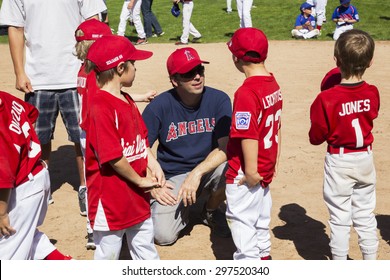 Oak View, California, USA, March 7, 2015, Ojai Valley Little League Field, Youth Baseball, Spring, Coach Speaks To Tee-Ball Division Players