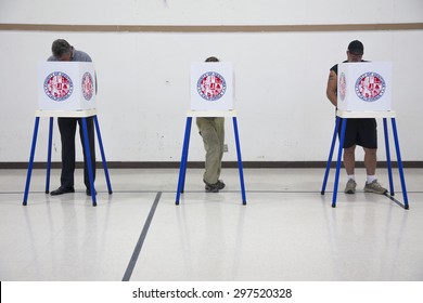 Oak View, California, USA, November 4, 2014, Citizen Votes In Election Booth Polling Station In Gymnasium