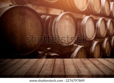 oak wood table on oak barrel background