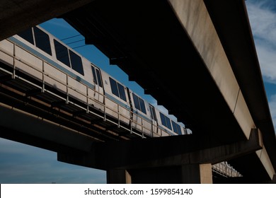 Oakland, CA - 12 27 2019: Bart Overpass Near Coliseum With Train