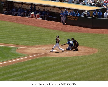 OAKLAND, CA - AUGUST 4: Royals Vs. Athletics: As Kurt Suzuki Swigs For Contact During At Bat.  Taken On August 4 2010 At Coliseum In Oakland California.