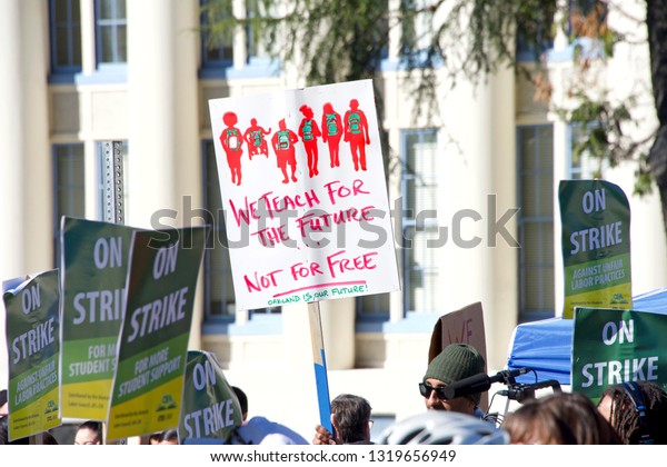 Oakland, CA -\
February 21, 2019: Oakland teachers strike outside of Oakland\
Technical High School, then marching to city hall. Fighting for\
smaller class sizes and bigger\
paychecks.