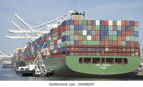 OAKLAND, CA - FEBRUARY 26, 2015: ROYAL MELBOURNE Tugboat With BERNE BRIER Barge Providing Maritime Services For CSCL Cargo Ship AMERICA While Loading At The Port Of Oakland.