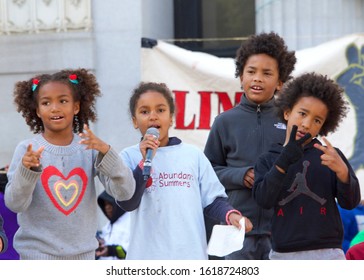 Oakland, CA - Jan 17, 2020: Unidentified participants of Youth vs Apocalypse Climate protest in front of City Hall. Many young students take time off from class on Fridays to protest climate change.