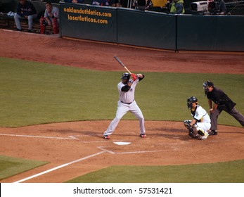 OAKLAND, CA - JULY 19: Red Sox Vs. Athletics: Red Sox David Ortiz Up To Bat With Kurt Suzuki Catching  Taken On July 19, 2010 At The Coliseum In Oakland California.