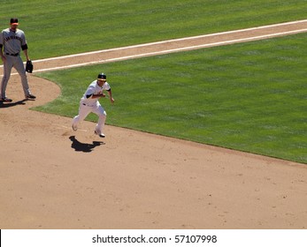 OAKLAND, CA - MAY 23: San Francisco Giants Vs. Oakland Athletics: Kurt Suzuki Looks Towards The Outfield As He Begins To Sprint Towards Second.  May 23 2010 At Coliseum Oakland California.