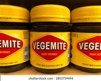 Oakland, CA - Nov 12, 2020: Grocery store shelf with jars of Vegemite brand Yeast Extract, a thick black Australian food spread made from leftover brewers yeast extract with vegetables and spice 