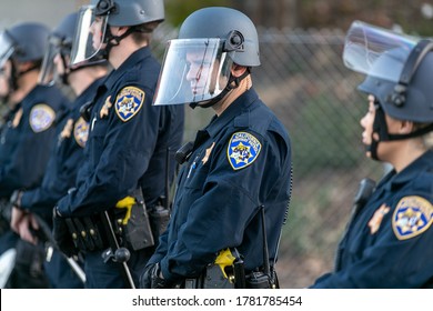Oakland, California - 6/10/20: California Highway Patrol officers guard the entrance to Interstate 580 freeway from demonstrators from the George Floyd protest.