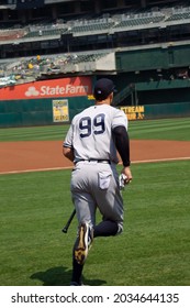 Oakland, California - August 28, 2021:  Aaron Judge #99 Of The New York Yankees Runs Out To The Batting Cage Before The Game Against The Oakland Athletics At RingCentral Coliseum.