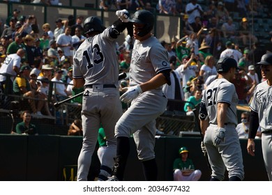 Oakland, California - August 28, 2021: Aaron Judge #99 And Joey Gallo #13 Of The New York Yankees Celebrate After Judge Hits A Home Run Against The Oakland Athletics At RingCentral Coliseum.