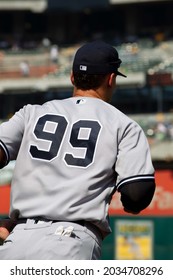 Oakland, California - August 28, 2021: New York Yankees' Aaron Judge #99 Runs To The Outfield During A Game Against The Oakland Athletics At RingCentral Coliseum.